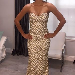 White and gold beaded strapless gown